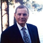 Ed Hardy, a man wearing a suit and tie, the leader of Yosemite Valley
